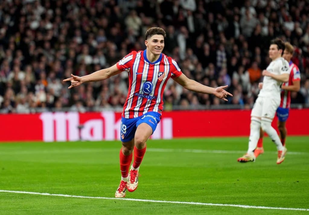 Julian Alvarez of Atletico de Madrid celebrates scoring his team's first goal from the penalty spo during the LaLiga match between Real Madrid CF and Atletico de Madrid at Estadio Santiago Bernabeu on February 08, 2025 in Madrid, Spain. 