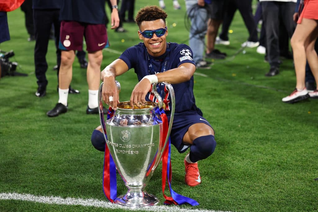 Desire Doue of Paris Saint Germain celebrates with the trophy after the UEFA Champions League Final 2025 between Paris Saint-Germain and FC Internazionale Milano at Munich Football Arena on May 31, 2025 in Munich, Germany.