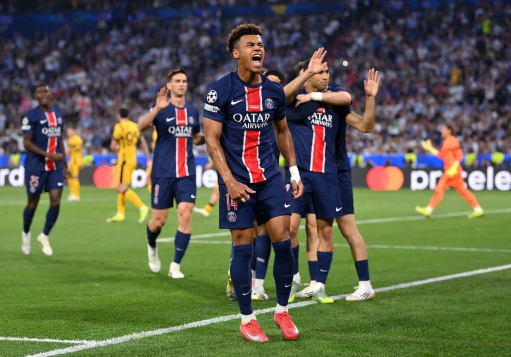 Desire Doue of Paris Saint-Germain celebrates after Achraf Hakimi of Paris Saint-Germain (obscured) scores his team's first goal during the UEFA Champions League Final 2025 between Paris Saint-Germain and FC Internazionale Milano at Munich Football Arena on May 31, 2025 in Munich, Germany. 