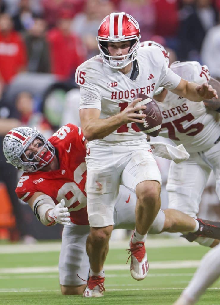 INDIANAPOLIS, INDIANA - DECEMBER 6: Fernando Mendoza #15 of the Indiana Hoosiers runs the ball against the Ohio State Buckeyes in the 2025 Big Ten Championship game at Lucas Oil Stadium on December 6, 2025 in Indianapolis, Indiana. 