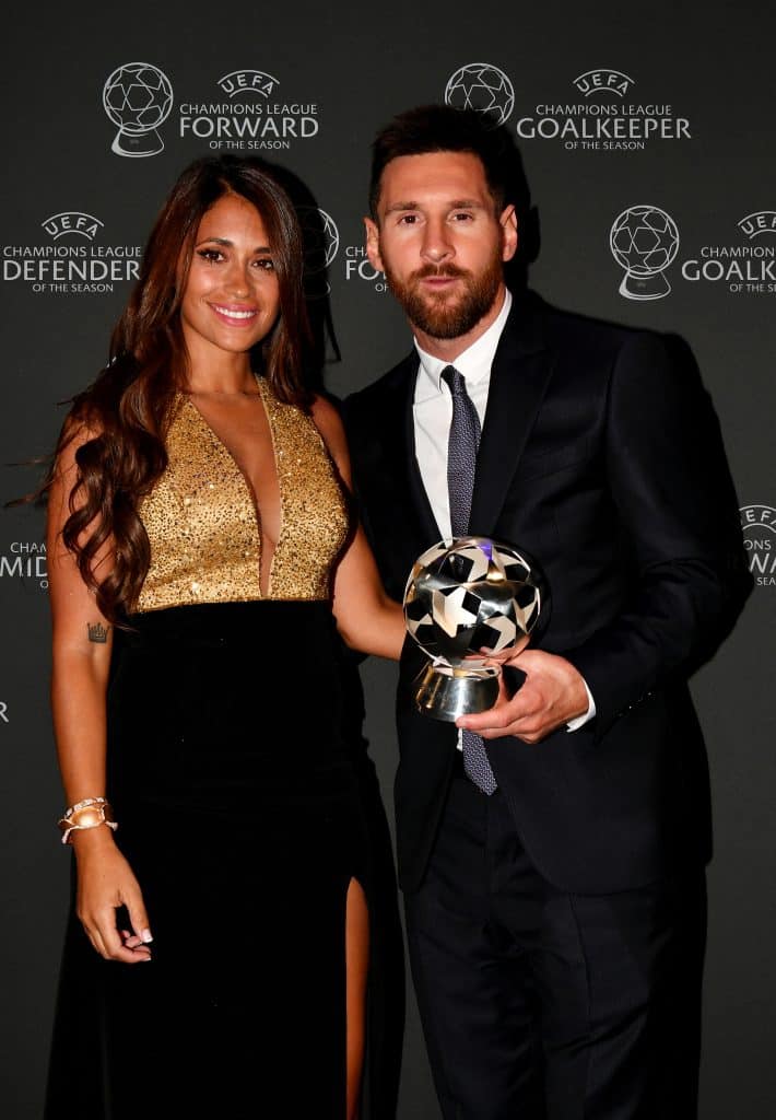 MONACO, MONACO - AUGUST 29: UEFA Champions League Forward of the Season 2018/19 Lionel Messi of FC Barcelona poses for a photo with his wife, Antonella Roccuzzo following the UEFA Champions League Draw, part of the UEFA European Club Football Season Kick-Off 2019/2020 at Salle des Princes, Grimaldi Forum on August 29, 2019 in Monaco, Monaco. (Photo by Harold Cunningham - UEFA/UEFA via Getty Images)