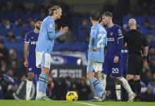 LONDON, ENGLAND - NOVEMBER 12: Former team-mates Erling Haaland of Manchester City and Cole Palmer of Chelsea exchange words at the re-start after Palmer scores from the spot to make it 4-4 during the Premier League match between Chelsea FC and Manchester City at Stamford Bridge on November 12, 2023 in London, England.