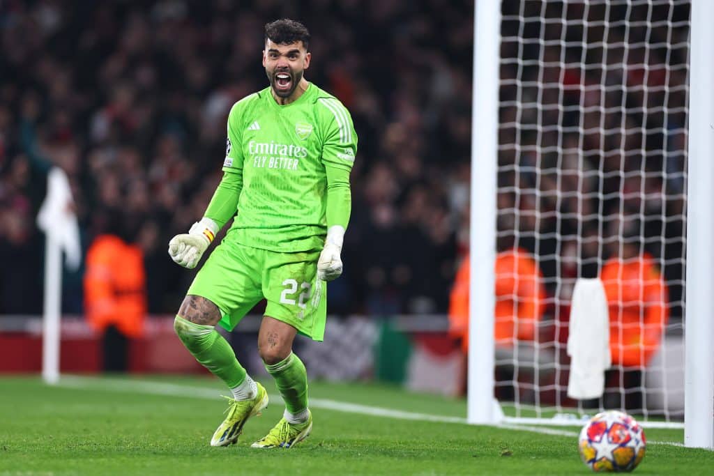 LONDON, ENGLAND - MARCH 12: David Raya of Arsenal celebrates after saving a penalty from Wendell of FC Porto during the UEFA Champions League 2023/24 round of 16 second leg match between Arsenal FC and FC Porto at Emirates Stadium on March 12, 2024 in London, England.