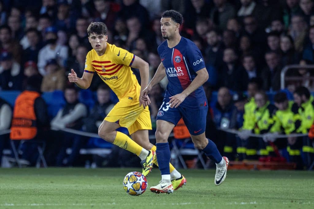 PARIS, FRANCE - APRIL 10: Warren Zaire-Emery #33 of Paris Saint-Germain defended by Pau Cubarsí #33 of Barcelona during the Paris Saint-Germain V Barcelona, UEFA Champions League, Quarter-Final, first leg tie at Parc des Princes on April 10th, 2024 in Paris, France 