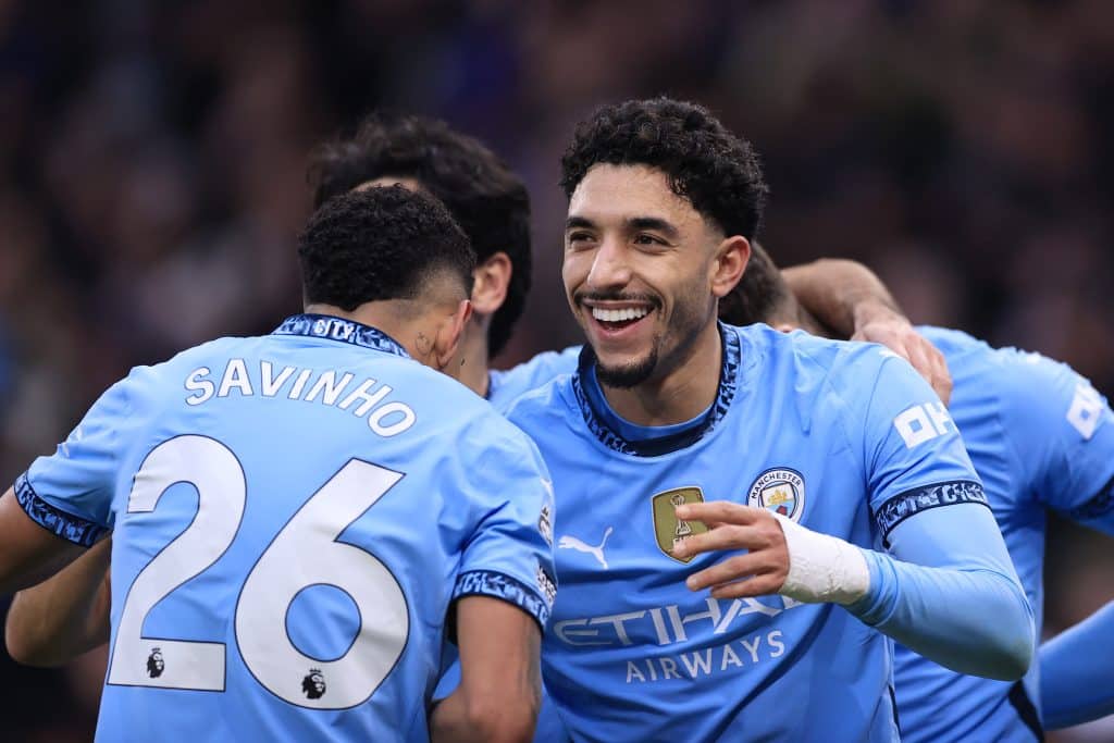 MANCHESTER, ENGLAND - FEBRUARY 15: Omar Marmoush of Manchester City (R) celebrates with Savinho of Manchester City after scoring their 3rd goal during the Premier League match between Manchester City FC and Newcastle United FC at Etihad Stadium on February 15, 2025 in Manchester, England. 