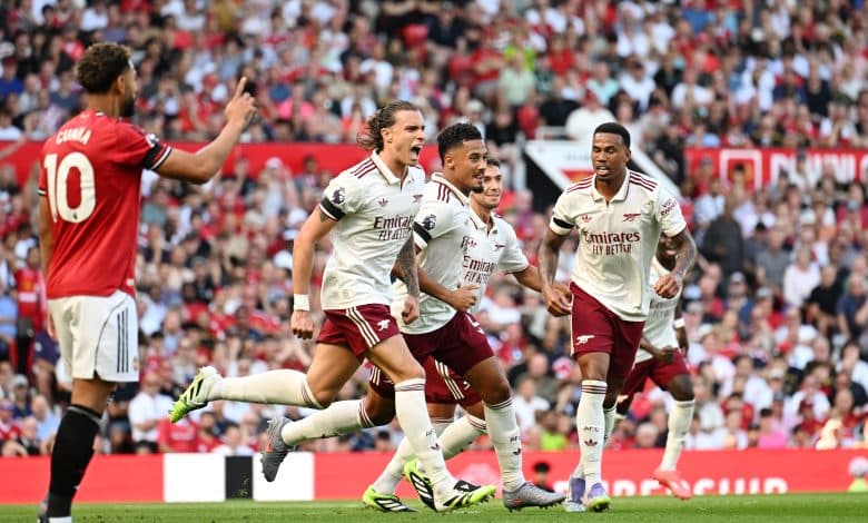 MANCHESTER, ENGLAND - AUGUST 17: Riccardo Calafiori of Arsenal celebrates scoring his team's first goal with William Saliba and Gabriel of Arsenal during the Premier League match between Manchester United and Arsenal at Old Trafford on August 17, 2025 in Manchester, England.