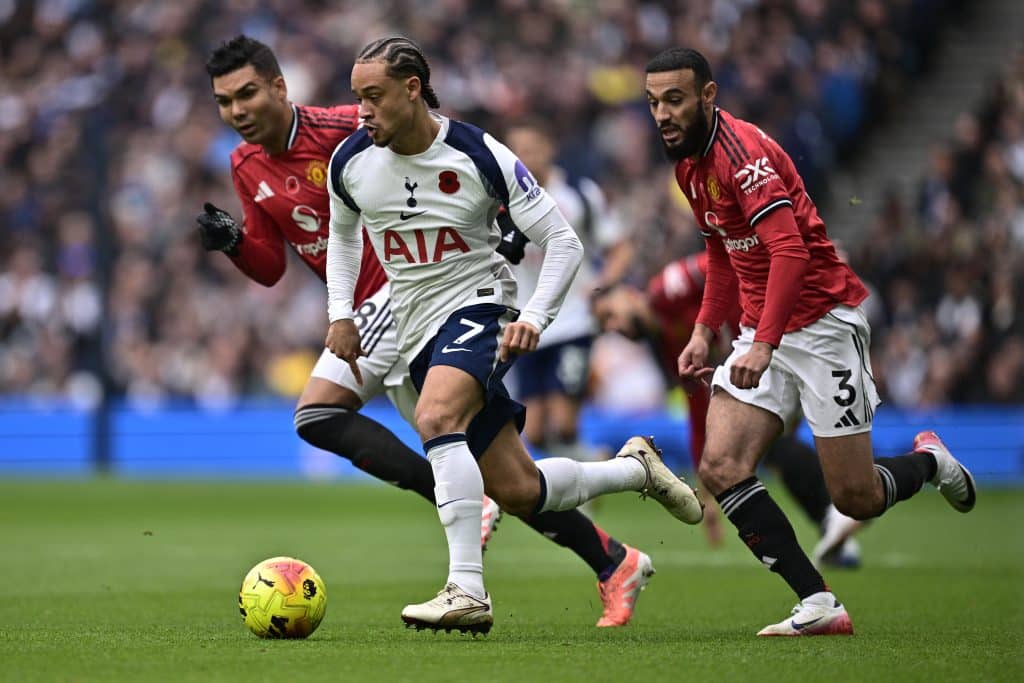 LONDON, ENGLAND - NOVEMBER 8: Xavi Simons of Tottenham Hotspurs and Noussair Mazraoui of Manchester United F.C. battle for a ball during the Premier League match between Tottenham Hotspur and Manchester United at Tottenham Hotspur Stadium on November 8, 2025 in London, England. 