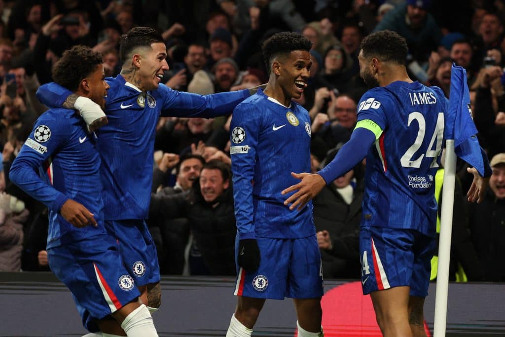 Chelsea's Brazilian midfielder #41 Estevao (C) celebrates with teammates after scoring their second goal during the UEFA Champions League league-phase football match between Chelsea and Barcelona at Stamford Bridge in London on November 25, 2025. 