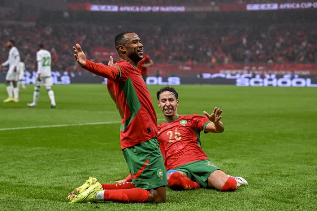 Morocco's forward #20 Ayoub El Kaabi calebrates his goal with Morocco's defender #26 Anass Salah-Eddine during the Africa Cup of Nations (CAN) group A  football match between Morocco and Comoros at Prince Moulay Abdellah Stadium in Rabat on December 21, 2025. 