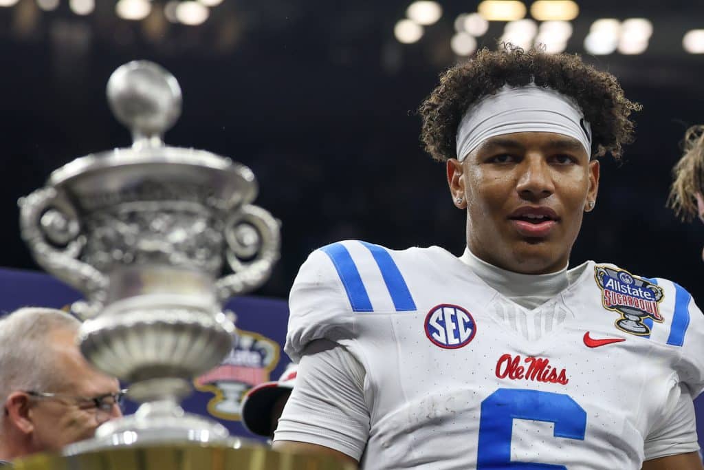 NEW ORLEANS, LA - JANUARY 01: QB Trinidad Chambliss #6 of the Ole Miss Rebels stands on the podium with the trophy in the foreground after winning the College Football Playoff Quarterfinal at the Allstate Sugar Bowl between Ole Miss Rebels and Georgia Bulldogs on January 1, 2026, at Caesars Superdome in New Orleans, LA. 