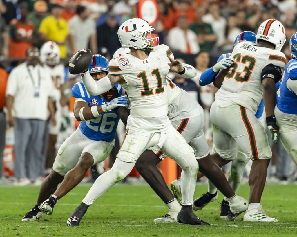Carson Beck #11 of the Miami (FL) Hurricanes passes the ball in the   of the 2025 College Football Playoff Semifinal at State Farm Stadium on January 8, 2026 in Glendale, Arizona. 