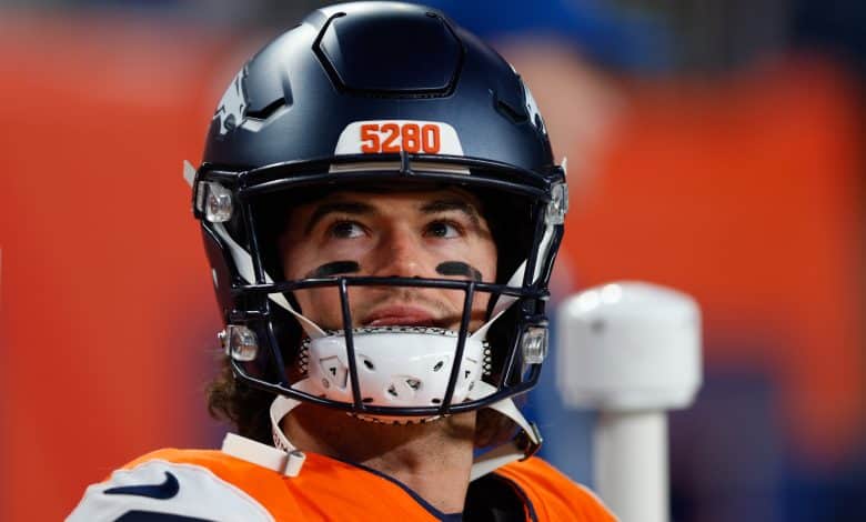 DENVER, CO - DECEMBER 21: Jarrett Stidham #8 of the Denver Broncos looks on from the bench during the fourth quarter against the Jacksonville Jaguars at Empower Field at Mile High on December 21, 2025 in Denver, Colorado.