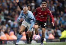 MANCHESTER, ENGLAND - SEPTEMBER 14: Luke Shaw of Manchester United attempts to stop Erling Braut Haaland of Manchester City during the Premier League match between Manchester City and Manchester United at Etihad Stadium on September 14, 2025 in Manchester, England.