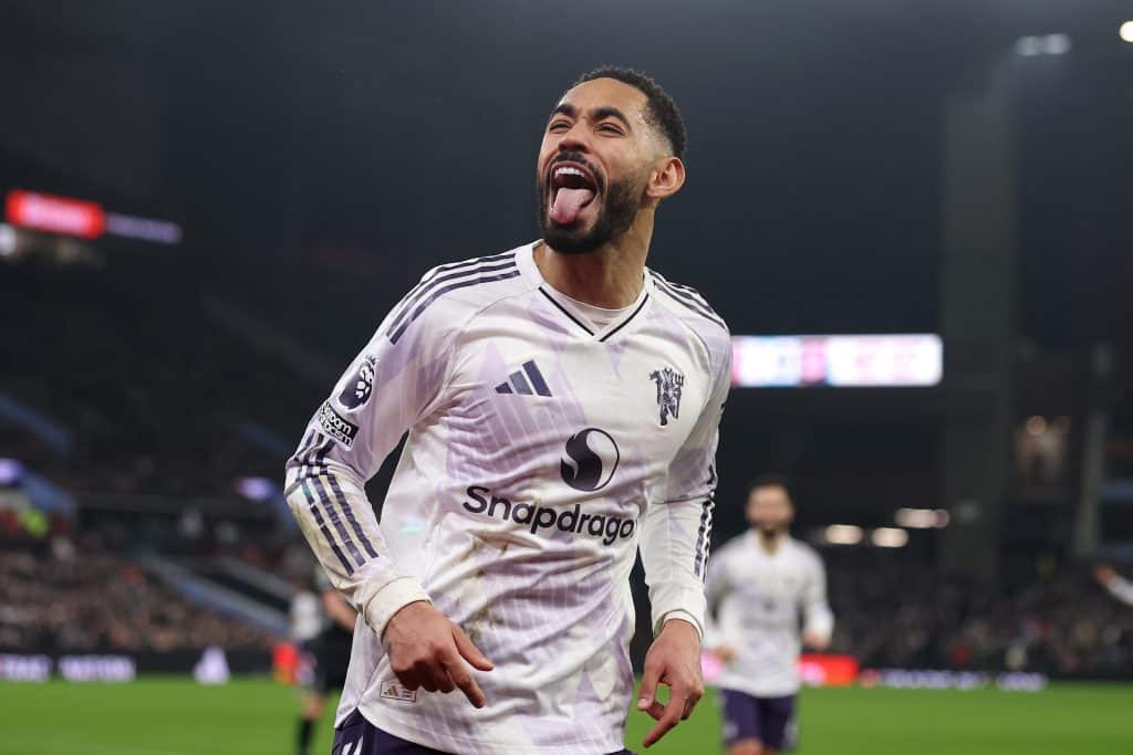 BIRMINGHAM, ENGLAND - DECEMBER 21: Matheus Cunha of Manchester United celebrates scoring his team's first goal during the Premier League match between Aston Villa and Manchester United at Villa Park on December 21, 2025 in Birmingham, England. 