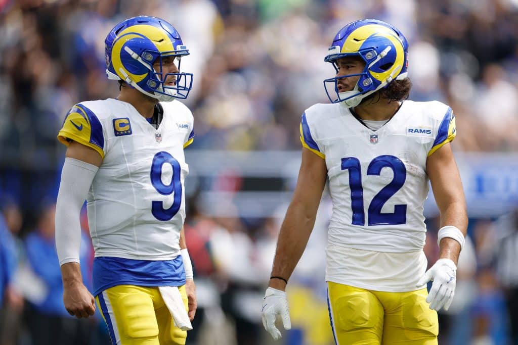 INGLEWOOD, CALIFORNIA - SEPTEMBER 07: Matthew Stafford #9 and Puka Nacua #12 of the Los Angeles Rams talk in the first quarter of a game against the Houston Texans at SoFi Stadium on September 07, 2025 in Inglewood, California. 