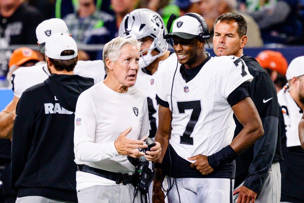 SEATTLE, WASHINGTON - AUGUST 7: Las Vegas Raiders Head coach Pete Carroll chats with Geno Smith #7 during the third quarter of the NFL Preseason 2025 game against the Seattle Seahawks at Lumen Field on August 7, 2025 in Seattle, Washington. 