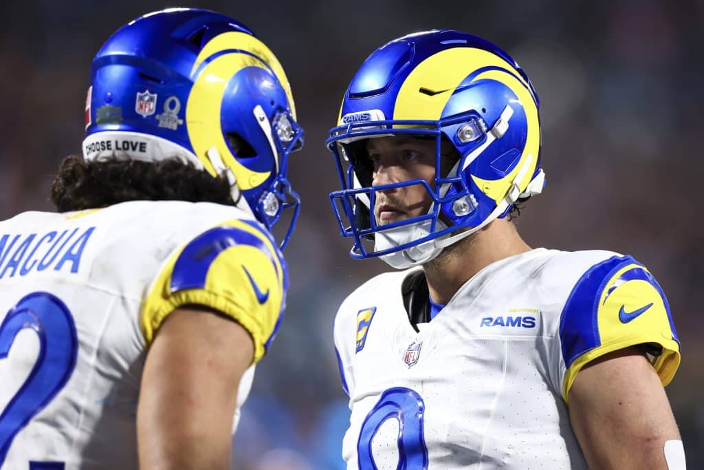 CHARLOTTE, NORTH CAROLINA - JANUARY 10: Matthew Stafford #9 of the Los Angeles Rams celebrates with Puka Nacua #12 after throwing a touchdown pass during the fourth quarter of an NFL wild card playoff game against the Carolina Panthers at Bank of America Stadium on January 10, 2026 in Charlotte, North Carolina. 