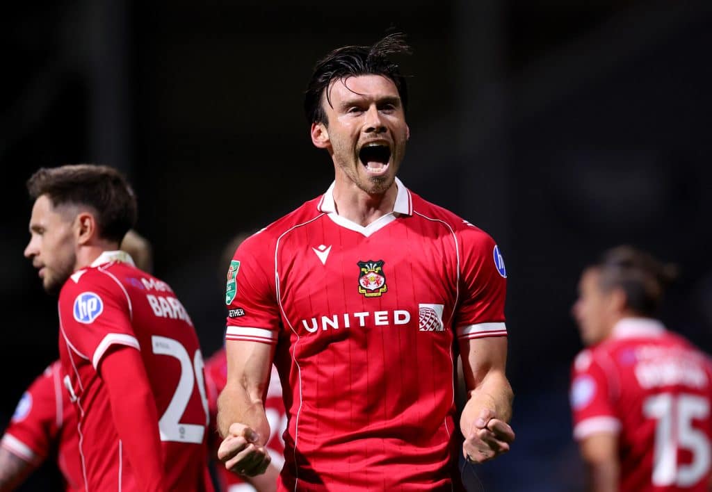PRESTON, ENGLAND - AUGUST 26: Kieffer Moore of Wrexham celebrates scoring his team's third goal during the Carabao Cup Second Round match between Preston North End and Wrexham at Deepdale on August 26, 2025 in Preston, England.  