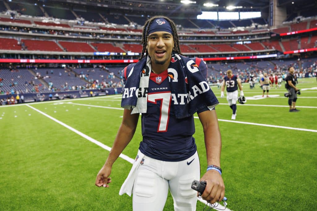 HOUSTON, TEXAS - AUGUST 19: C.J. Stroud #7 of the Houston Texans walks off the field after the preseason game against the Miami Dolphins at NRG Stadium on August 19, 2023 in Houston, Texas. The Dolphins defeated the Texans 28-3.  