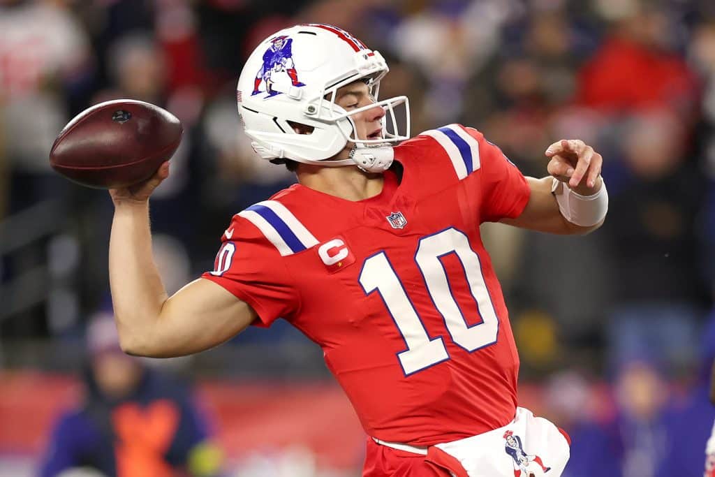 Drake Maye #10 of the New England Patriots makes a pass during the first quarter of the game against the New York Giants at Gillette Stadium on December 01, 2025 in Foxborough, Massachusetts.