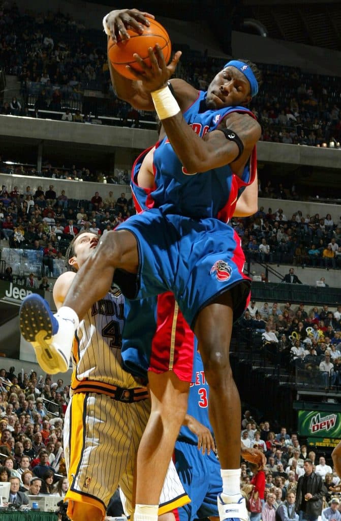 INDIANAPOLIS - DECEMBER 19:  Ben Wallace #3 of the Detroit Pistons grabs a rebound against the Indiana Pacers on December19, 2003 at Conseco Fieldhouse in Indianapolis, Indiana. 