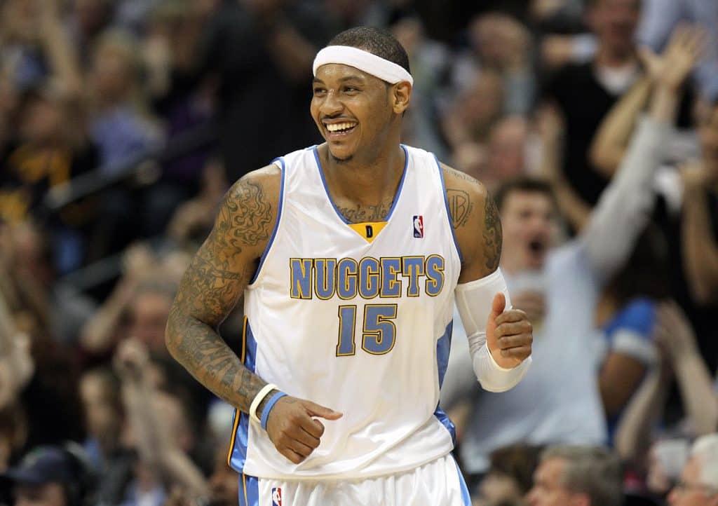 DENVER, CO - APRIL 17 : Carmelo Anthony #15 of the Denver Nuggets celebrates after sinking a shot against the Utah Jazz during the second half of Game One of the Western Conference Quarterfinals of the 2010 NBA Playoffs at the Pepsi Center on April 17, 2010 in Denver, Colorado. The Nuggets won the game 126-113 to take a 1-0 lead in the series.