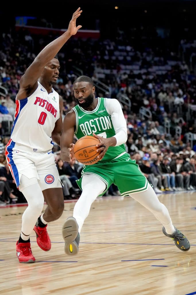 DETROIT, MICHIGAN - OCTOBER 26: Jaylen Brown #7 of the Boston Celtics drives to the basket against Jalen Duren #0 of the Detroit Pistons at Little Caesars Arena on October 26, 2025 in Detroit, Michigan.