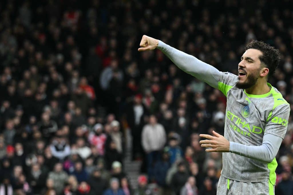Manchester City's French midfielder #10 Rayan Cherki celebrates after scoring their second goal during the English Premier League football match between Nottingham Forest and Manchester City at The City Ground in Nottingham, central England, on December 27, 2025.
