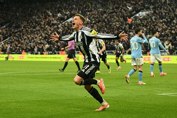 Newcastle United's English midfielder #11 Harvey Barnes celebrates after scoring their second goal during the English Premier League football match between Newcastle United and Manchester City at St James' Park in Newcastle-upon-Tyne, north east England on November 22, 2025. (Photo by Oli SCARFF / AFP via Getty Images) / RESTRICTED TO EDITORIAL USE. No use with unauthorized audio, video, data, fixture lists, club/league logos or 'live' services. Online in-match use limited to 120 images. An additional 40 images may be used in extra time. No video emulation. Social media in-match use limited to 120 images. An additional 40 images may be used in extra time. No use in betting publications, games or single club/league/player publications. /